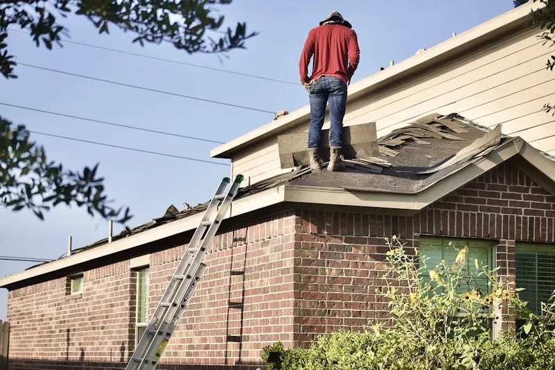 Professional roofer working on a residential roof in Pen Argyl